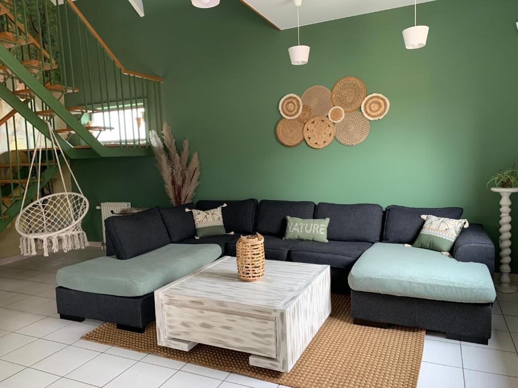 a living room with a couch and a coffee table at La Maison de Mel in Bois le Duc