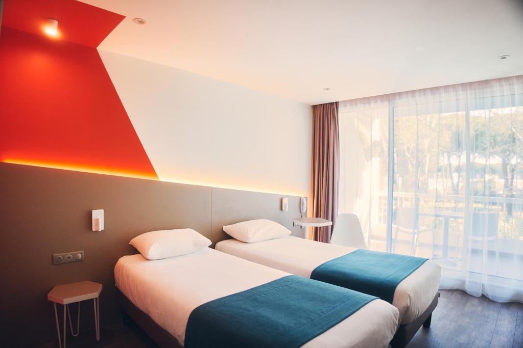 Postel nebo postele na pokoji v ubytování Hotel Le Quetzal