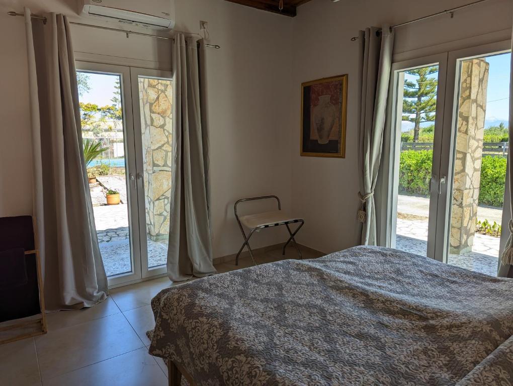 Postel nebo postele na pokoji v ubytování Almyros Garden House