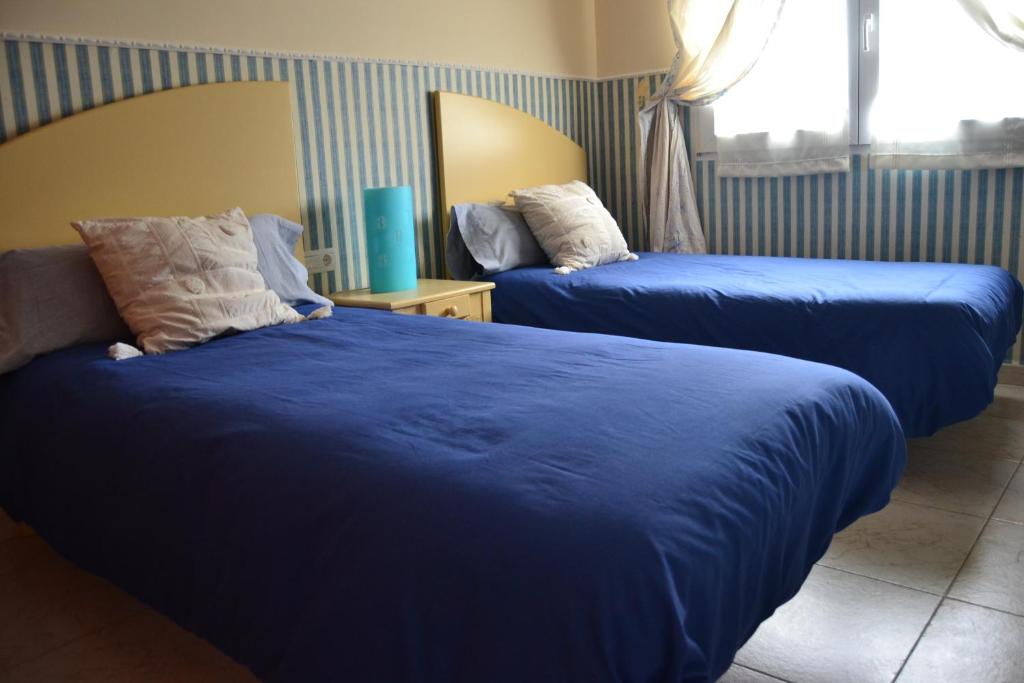 Postel nebo postele na pokoji v ubytování La Gala