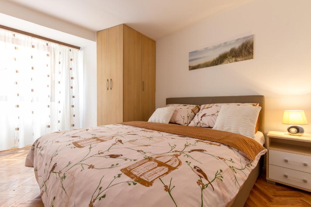 a bedroom with a large bed in a room at Bernard Old Town Apartment in Split