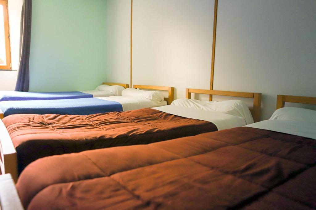 Postel nebo postele na pokoji v ubytování AU CHAT BLEU