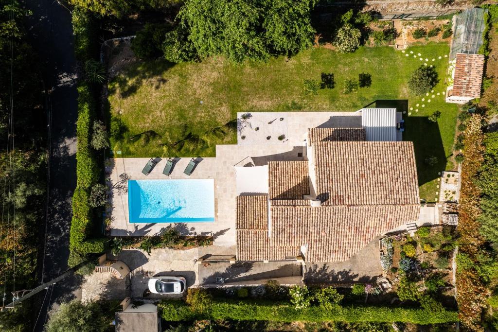an overhead view of a house with a pool at SERRENDY Calm family house with swimming pool in Antibes