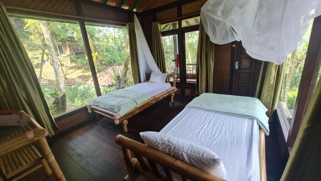 Postel nebo postele na pokoji v ubytování Rimba eco Resort