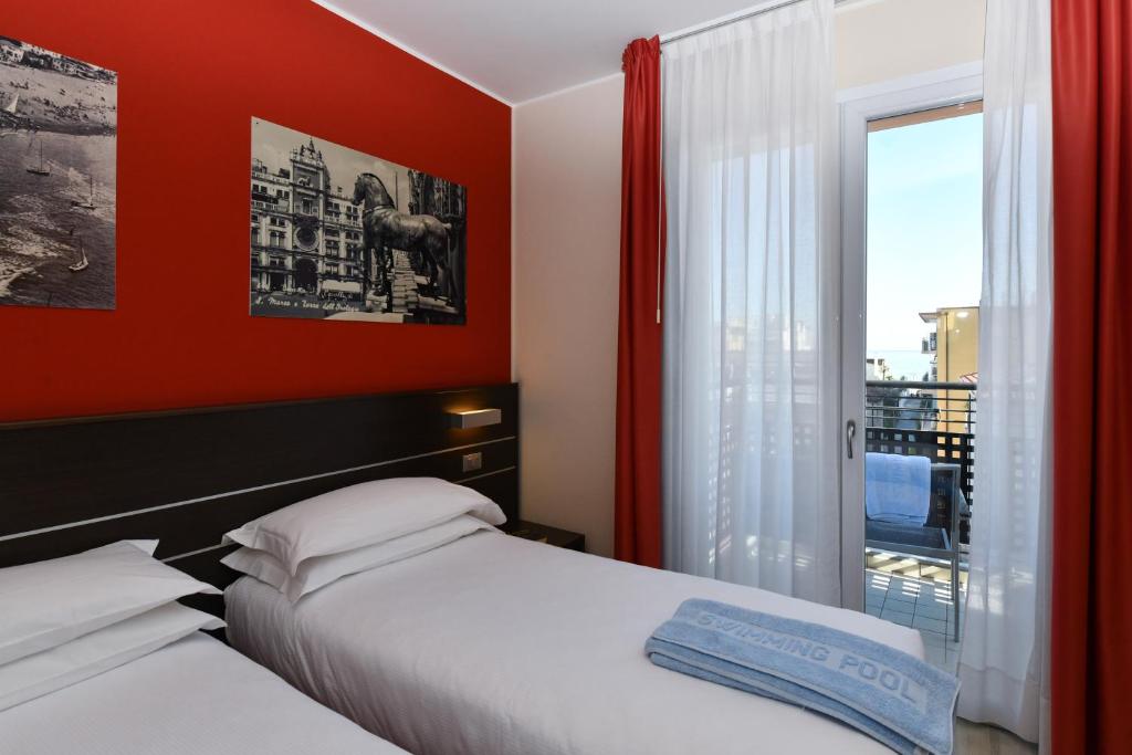 Posteľ alebo postele v izbe v ubytovaní Hotel Vienna