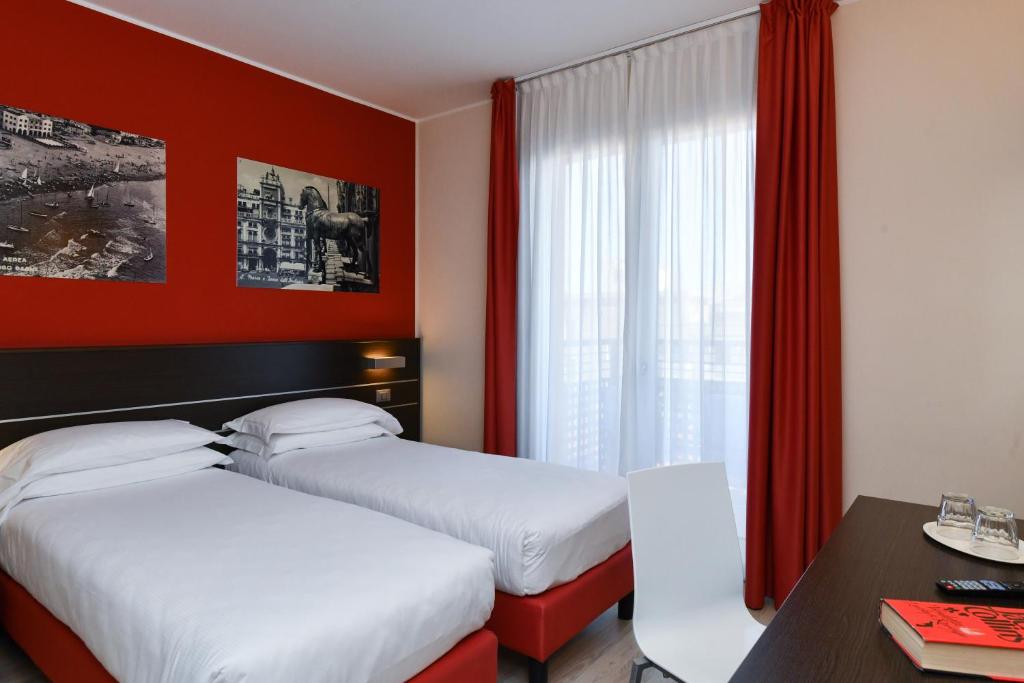 Posteľ alebo postele v izbe v ubytovaní Hotel Vienna