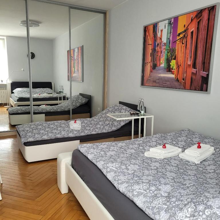 Posteľ alebo postele v izbe v ubytovaní Apartament Przy Rynku