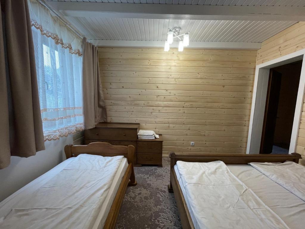 Postel nebo postele na pokoji v ubytování Lavina Hotel