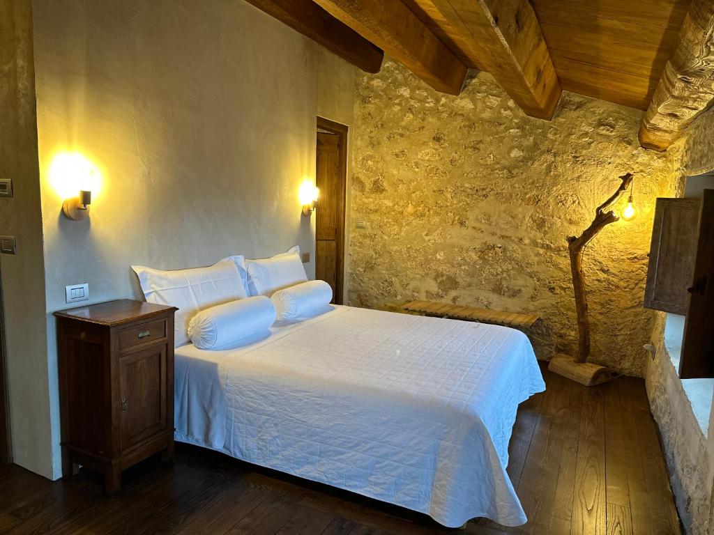 Postel nebo postele na pokoji v ubytování Charme in Perillis
