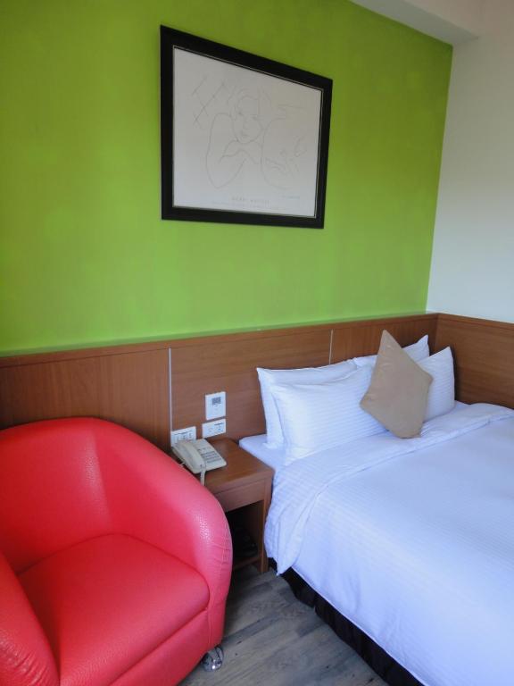 Postel nebo postele na pokoji v ubytování Royal Hotel