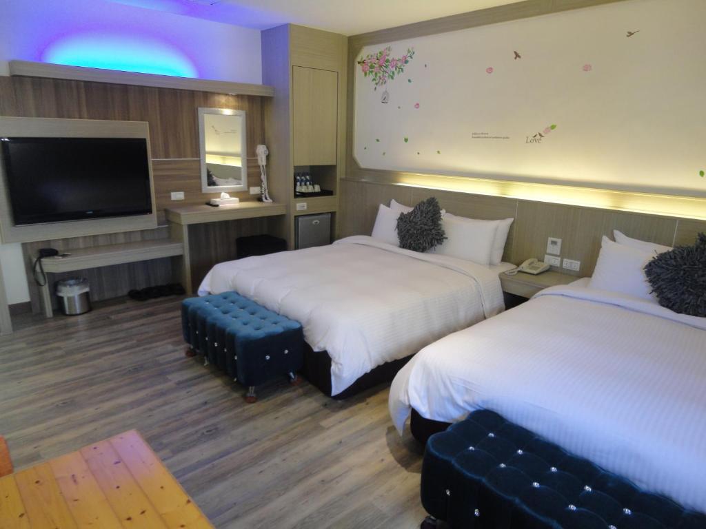 Postel nebo postele na pokoji v ubytování Royal Hotel