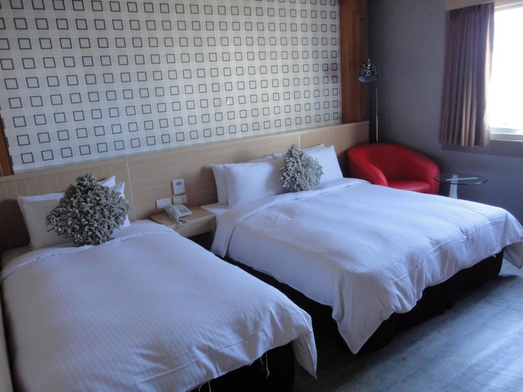 Postel nebo postele na pokoji v ubytování Royal Hotel