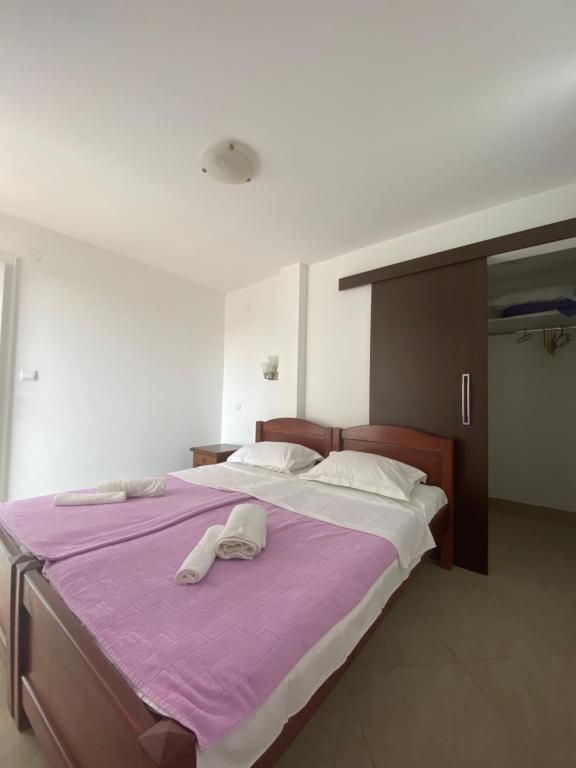 Postel nebo postele na pokoji v ubytování Apartmani IVA Bečići