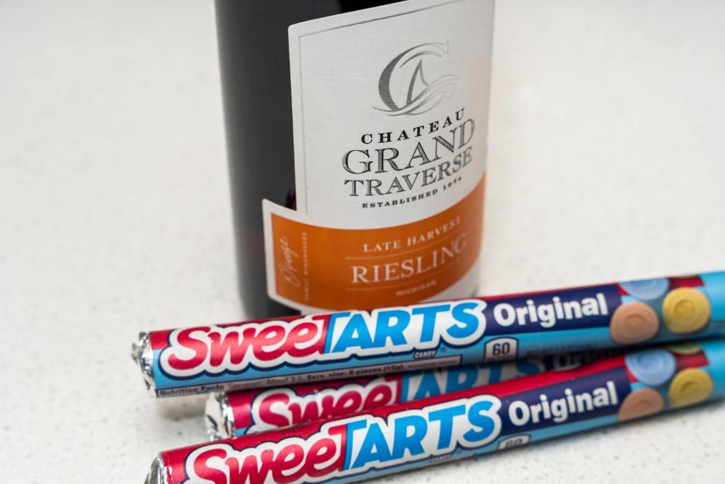 a stack of snickers snacks next to a bottle of drugs at Sweet Tart Spot - Cozy TC Condo - Pet Friendly in Traverse City
