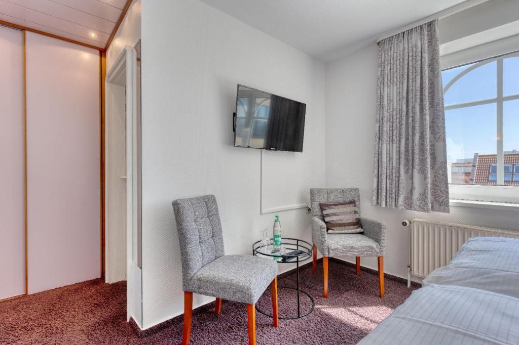 TV a/nebo společenská místnost v ubytování Strandvilla an der Kaiserwiese