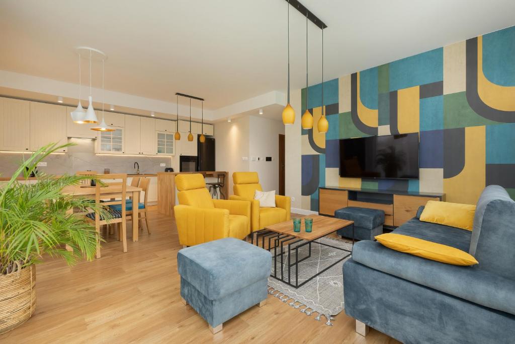 Telewizja i/lub zestaw kina domowego w obiekcie Sea&Sky View Apartment Par La Mer