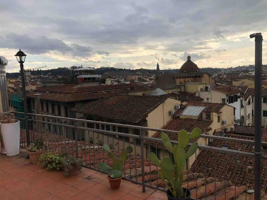 a view of a city from the roof of a building at rooftop scala in Florence