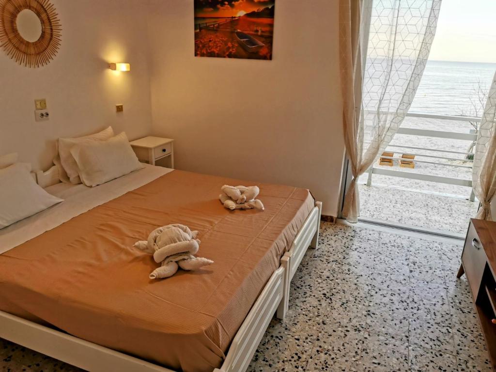 Posteľ alebo postele v izbe v ubytovaní Anatolikos Rooms