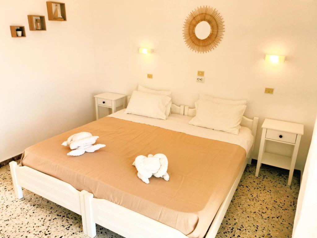 Posteľ alebo postele v izbe v ubytovaní Anatolikos Rooms