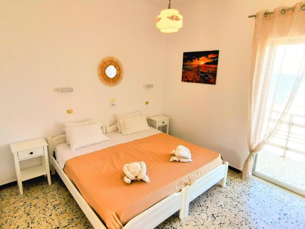 Posteľ alebo postele v izbe v ubytovaní Anatolikos Rooms