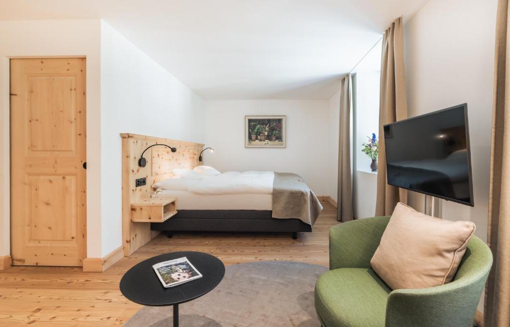 Postel nebo postele na pokoji v ubytování Parkhotel Margna Superior