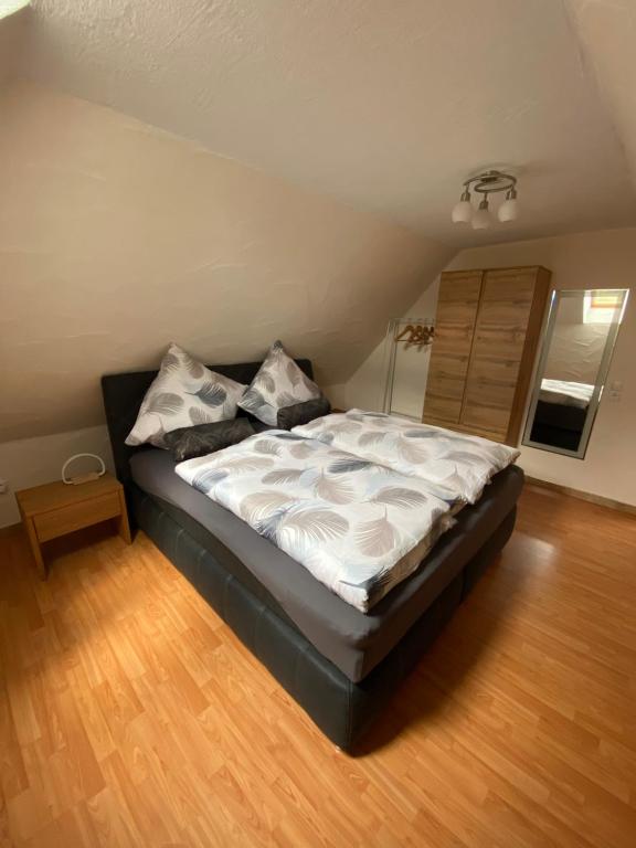 a bedroom with a large bed with pillows on it at Ferienhaus Heidi in Bundenthal