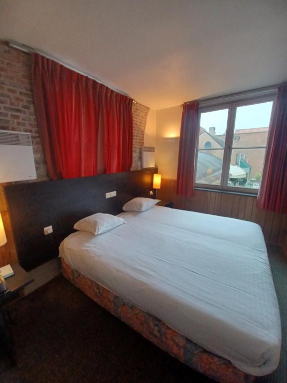 Postel nebo postele na pokoji v ubytování Hotel Koffieboontje