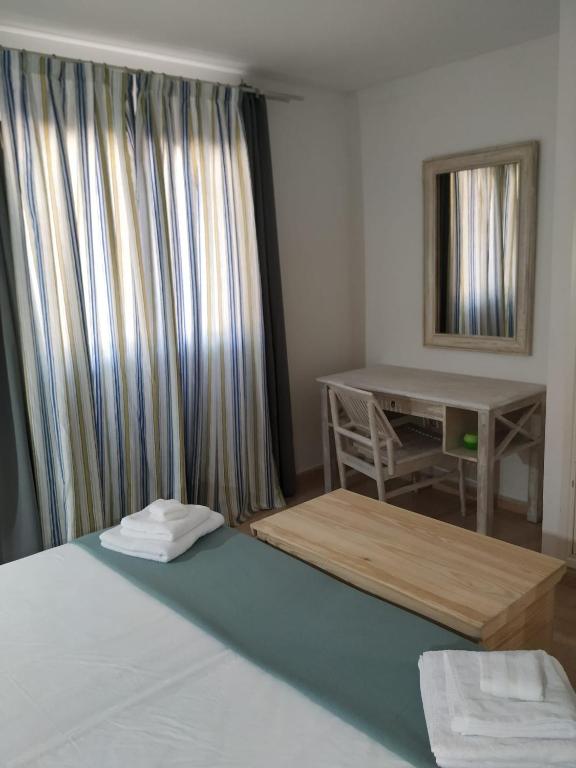 Postel nebo postele na pokoji v ubytování Casa Sotavento