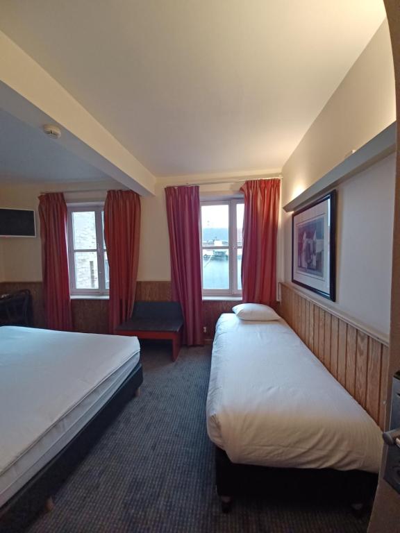 Postel nebo postele na pokoji v ubytování Hotel Koffieboontje