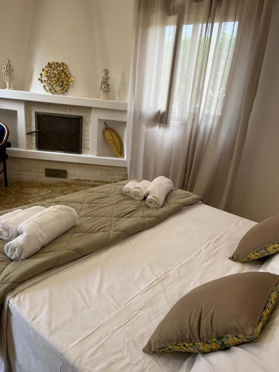 Postel nebo postele na pokoji v ubytování Dirò Camere