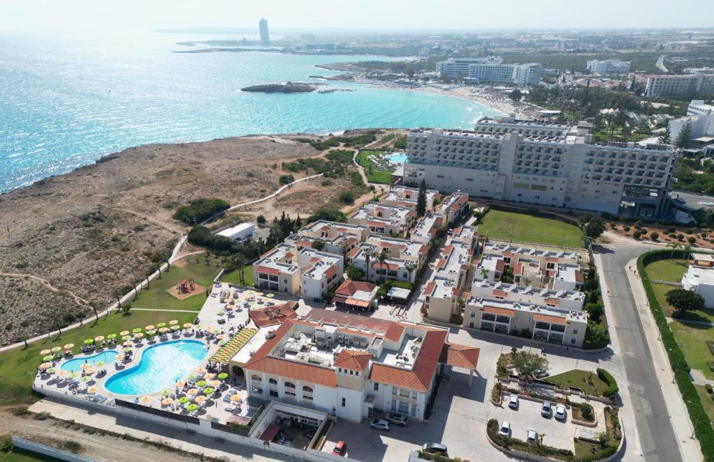 an aerial view of a resort and the ocean at Aktea Beach Village in Ayia Napa