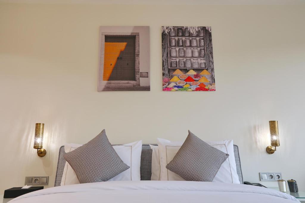 Postel nebo postele na pokoji v ubytování Ari Boutique Hôtel - Adult Only