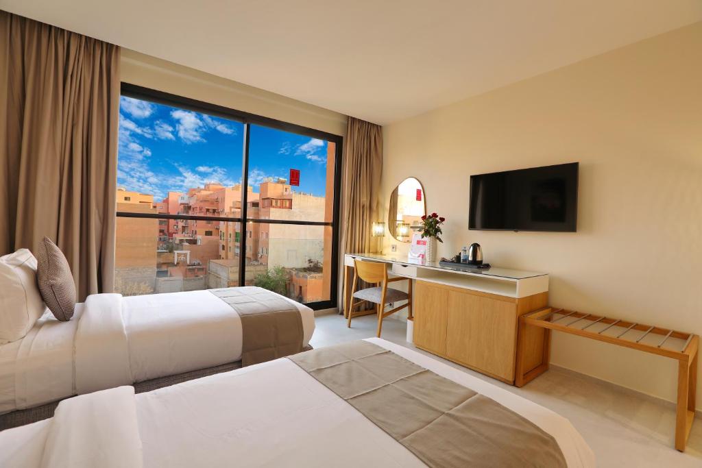 Postel nebo postele na pokoji v ubytování Ari Boutique Hôtel - Adult Only