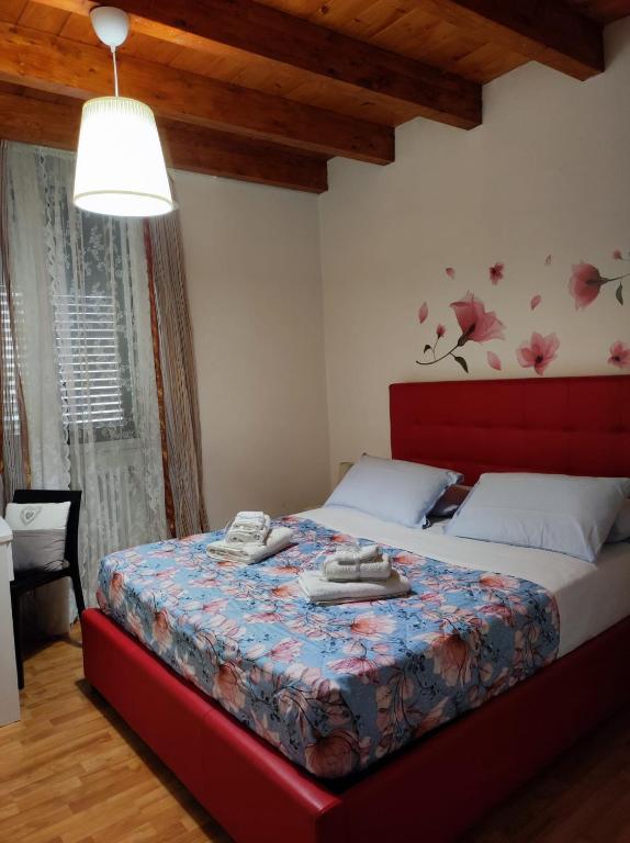 Un ou plusieurs lits dans un hébergement de l'établissement Miro B&B