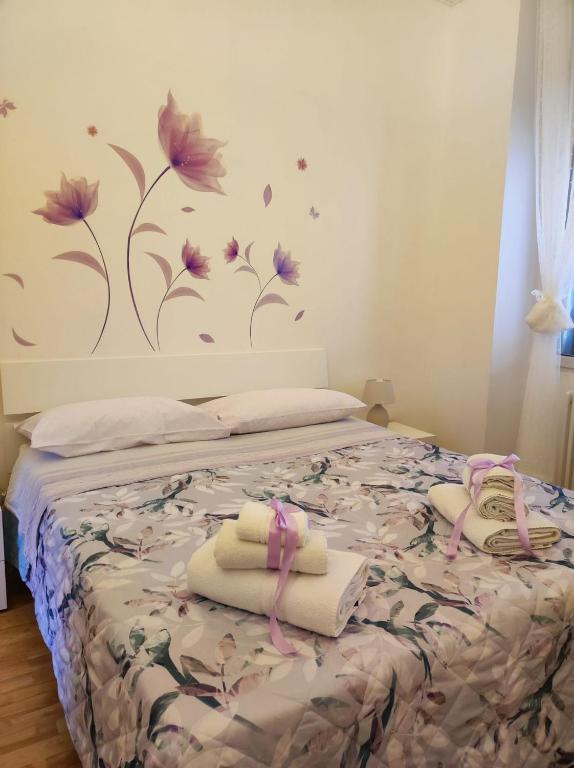 Un ou plusieurs lits dans un hébergement de l'établissement Miro B&B