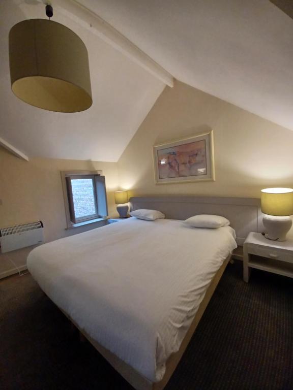 Postel nebo postele na pokoji v ubytování Hotel Koffieboontje