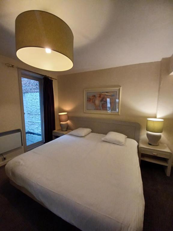Postel nebo postele na pokoji v ubytování Hotel Koffieboontje