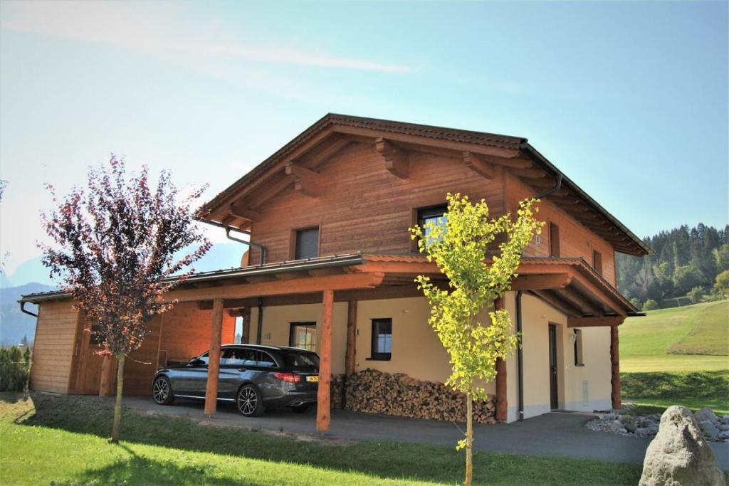 a car parked in front of a house at Chalet Giusto in Kötschach