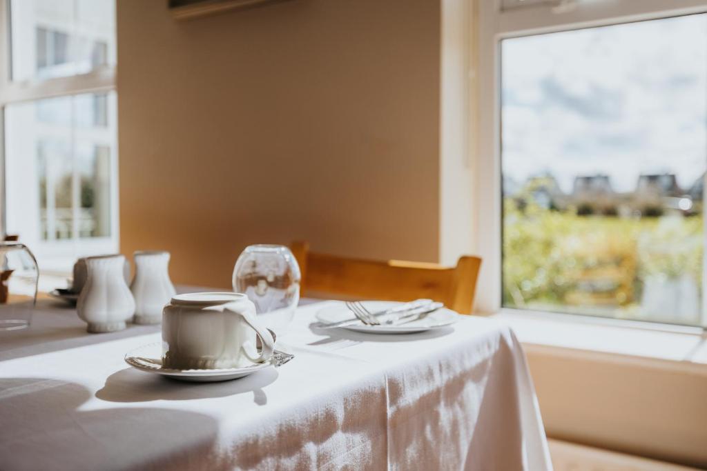 Postel nebo postele na pokoji v ubytování Móinéir House