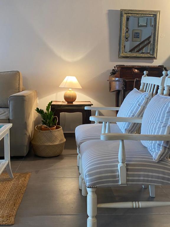 a living room with two beds and a couch at Beachfront House Pythagorion in Pythagoreio