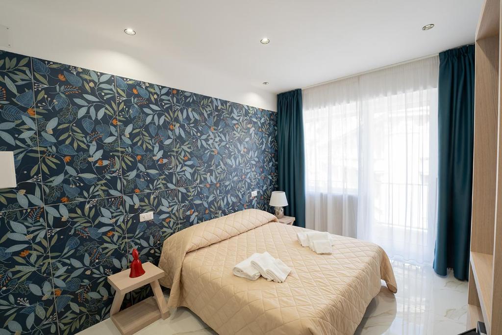 Posteľ alebo postele v izbe v ubytovaní P.C. Boutique H. De Gasperi, Napoli Centro, by ClaPa Group