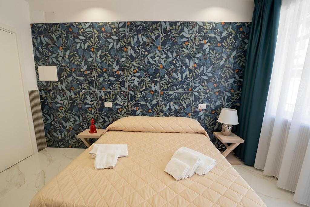 Posteľ alebo postele v izbe v ubytovaní P.C. Boutique H. De Gasperi, Napoli Centro, by ClaPa Group