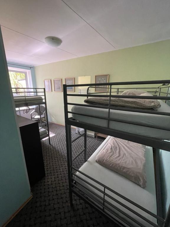 Postel nebo postele na pokoji v ubytování Mikalo House