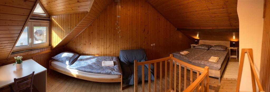 a small room with a bed in a cabin at Holiday Home Kristi in Bovec