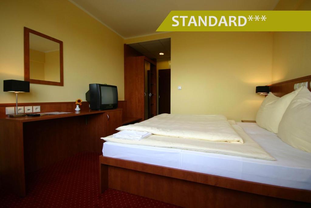 Postel nebo postele na pokoji v ubytování Hotel Ludmila