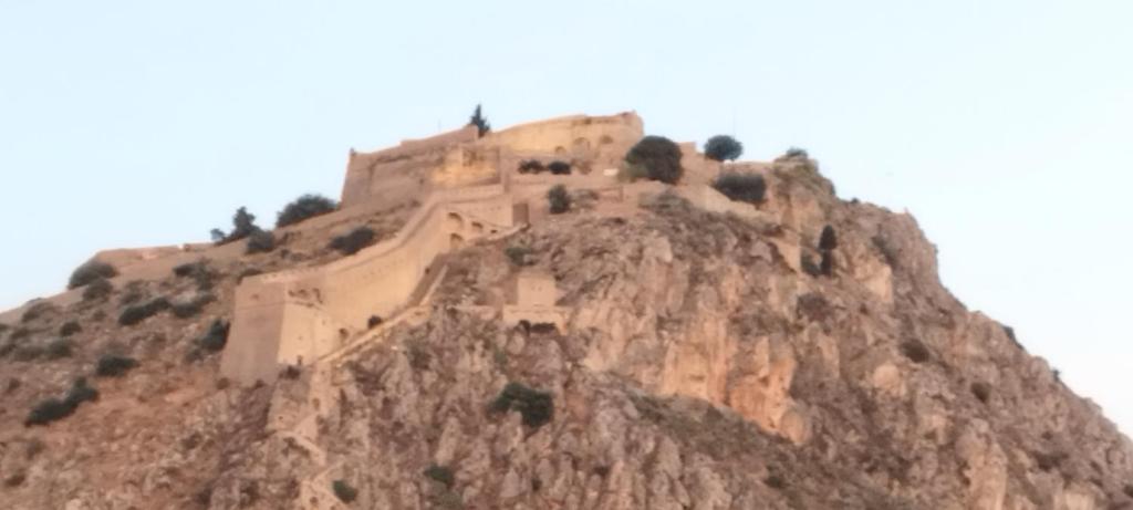 a castle on the top of a mountain at Villa Kazarma in Metókhion