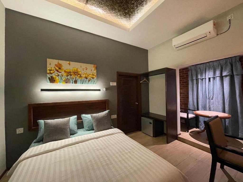 Postel nebo postele na pokoji v ubytování Grand Lodge Langkawi