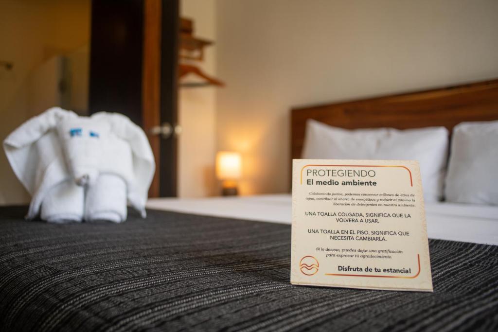 Postel nebo postele na pokoji v ubytování Hotel Muyu Tulum