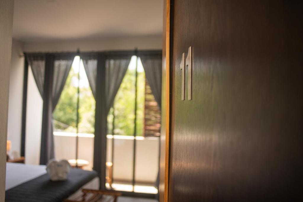 Postel nebo postele na pokoji v ubytování Hotel Muyu Tulum