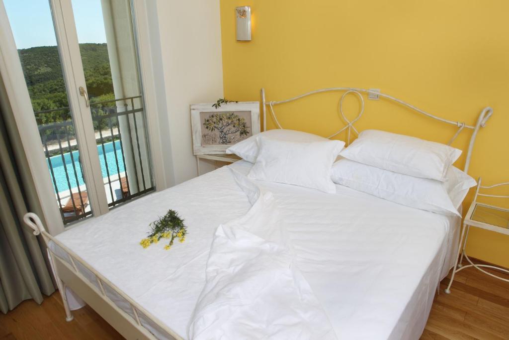 Postel nebo postele na pokoji v ubytování VILLA STEFANIJA small Boutique hotel&restaurant